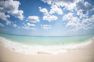 photography session with Kansas Pitts a shot of the gulf coast of Florida the beach has sugar white sand sand the water is crystal clear teal